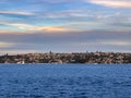 Sydney Harbour Australia at Sunset, lovely coloured skies boats ferries cruise liners houses and buildings