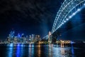 Sydney Harbour Bridge and the Sydney city skyline at night. Royalty Free Stock Photo