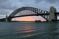 Sydney Harbour Bridge at sunset by clouded sky Royalty Free Stock Photo