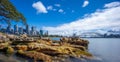 Sydney Harbour with nice rocks in the foreground the soft waves crashing on the shore NSW Australia Royalty Free Stock Photo