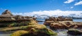 Sydney Harbour with nice rocks in the foreground the soft waves crashing on the shore NSW Australia Royalty Free Stock Photo