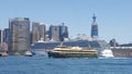 Sydney Harbour - View of city skyline with ocean cruiser and Manly Ferry in the foreground, Sydney, NSW, Australia