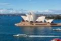 Sydney Opera House and ferry boats on a sunny day, view from the Harbour Bridge in Sydney