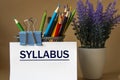 SYLLABUS - word on a white sheet against the background of pencils and a bouquet of lavender Royalty Free Stock Photo