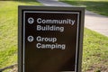 A Community Building and Group Camping sign directs visitors Royalty Free Stock Photo