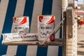 Cans of red fruit jelly from Gosch in a beach chair on the island Sylt, germany..