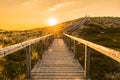 Sylt island wooden stairs at sunrise. Golden hour landscape Royalty Free Stock Photo