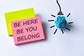 A symbol of belonging. words, be here, be you belong, written on colored cards, light bulb icon, business, belong, better team