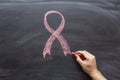 Symbol of Breast Cancer Awareness Ribbon design on blackboard