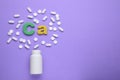 Symbol Ca Calcium, medical bottle and pills on violet background, top view. Space for text Royalty Free Stock Photo