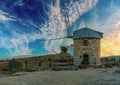 Symbol of the city of Bodrum Turkey ancient windmill on a hill. Sky with clouds