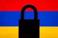 Silhouette of big black closed lock against flag of Armenia