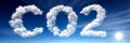 The Symbol of CO2 Emissions Created from Clouds and Sunshine on a Blue Sky Inspires Awareness Royalty Free Stock Photo