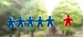 Symbol of discrimination. Blue figures are united wile red figure is isolated Royalty Free Stock Photo