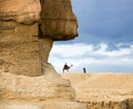 Symbol Egypt`s - pyramid, Sphinx, camel and tourists in the back Royalty Free Stock Photo