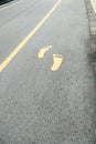 Symbol of foot walk lane on road Royalty Free Stock Photo