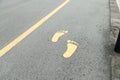 Symbol of foot walk lane on road Royalty Free Stock Photo