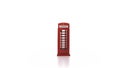 symbol of Great Britain is red telephone booth rotate on turntable on a white background. Toy miniature of the historic Royalty Free Stock Photo