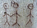 Symbol of a group of people carved in tree