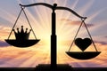 Symbol of the heart Altruism takes priority over the symbol of the crown of egoism on the scales of justice