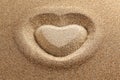 symbol of heart is drawn on clean sand Royalty Free Stock Photo