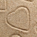symbol of heart is drawn on clean sand Royalty Free Stock Photo