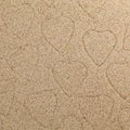 symbol of heart is drawn on clean sand Royalty Free Stock Photo