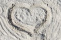 The symbol of heart is drawn on sand Royalty Free Stock Photo