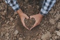 Symbol heart earth day. Handful of dirt hands heart shape. Farm organic earth. Farmer hands soil ground earth dirt garden soil Royalty Free Stock Photo