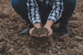 Symbol heart earth day. Handful of dirt hands heart shape. Farm organic earth. Farmer hands soil ground earth dirt garden soil Royalty Free Stock Photo