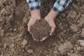 Symbol heart earth day. Handful of dirt hands heart shape. Farm organic earth. Farmer hands soil ground earth dirt garden soil Royalty Free Stock Photo