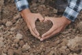 Symbol heart earth day. Handful of dirt hands heart shape. Farm organic earth. Farmer hands soil ground earth dirt garden soil Royalty Free Stock Photo