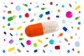 Symbol image of drugs danger : Many colorful medicines Pills and capsules with in the middle a big one on white Royalty Free Stock Photo