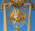 Symbol of Louis XIV the Sun King on the golden gate of Versailles Castle Royalty Free Stock Photo