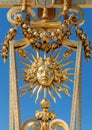 Symbol of Louis XIV the Sun King on the golden gate of Versailles Castle Royalty Free Stock Photo