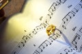 Symbol of love, Ring on the song books music notes Royalty Free Stock Photo