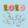 Symbol 2020 made of gold balloons and donuts with colorful streamers. Minimal Christmas or New Year concept. Flat lay