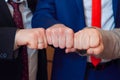 Symbol of male friendship and team. Fists group of businesspeople