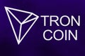 Symbol of new cryptocurrency - Tron Coin on ultra violet background