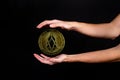 The symbol of the new popular cryptocurrency eosio with the image of hands Royalty Free Stock Photo