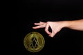 The symbol of the new popular cryptocurrency eosio with the image of hands Royalty Free Stock Photo