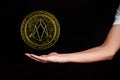 The symbol of the new popular cryptocurrency eosio with the image of hands Royalty Free Stock Photo