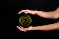 The symbol of the new popular cryptocurrency eosio with the image of hands Royalty Free Stock Photo