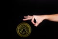 The symbol of the new popular cryptocurrency eosio with the image of hands