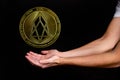 The symbol of the new popular cryptocurrency eosio with the image of hands Royalty Free Stock Photo