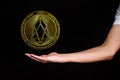 The symbol of the new popular cryptocurrency eosio with the image of hands Royalty Free Stock Photo