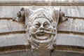 The symbol of the old antique statue with the face of a deity on a wall of the house on one of the streets of Lviv Royalty Free Stock Photo