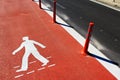 Symbol for pedestrians, pedestrian footway under construction.