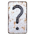 Symbol question mark made of forged metal on the background fragment of a metal surface with cracked rust. Royalty Free Stock Photo