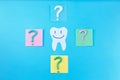 Symbol of question mark from toothpaste on blue background,
